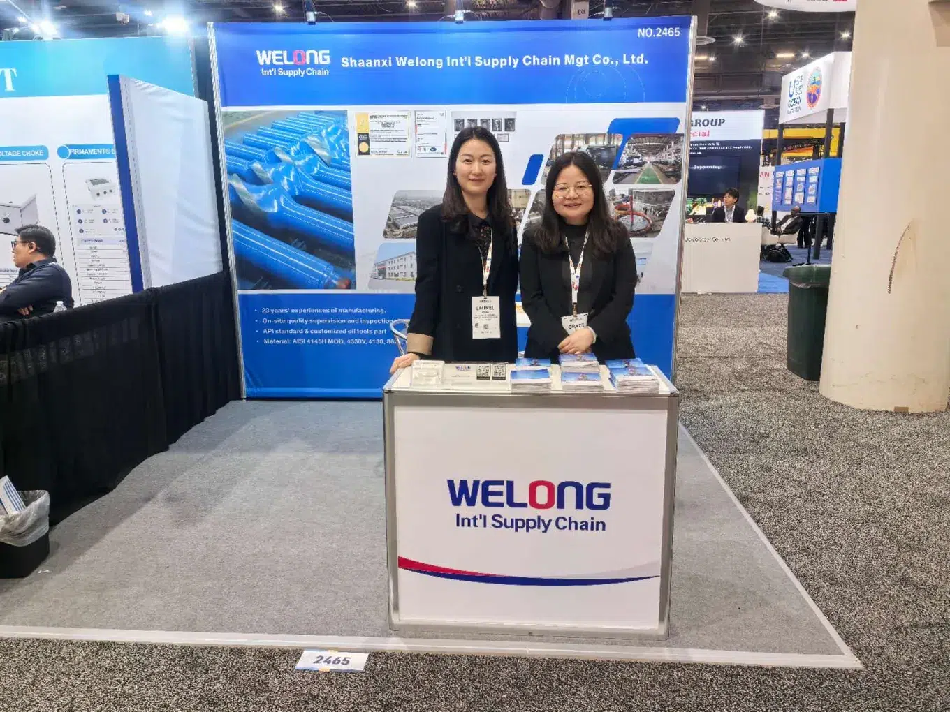 Welong team and visitors at an exhibition stand